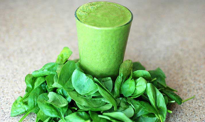 Green smoothie drink with leaves