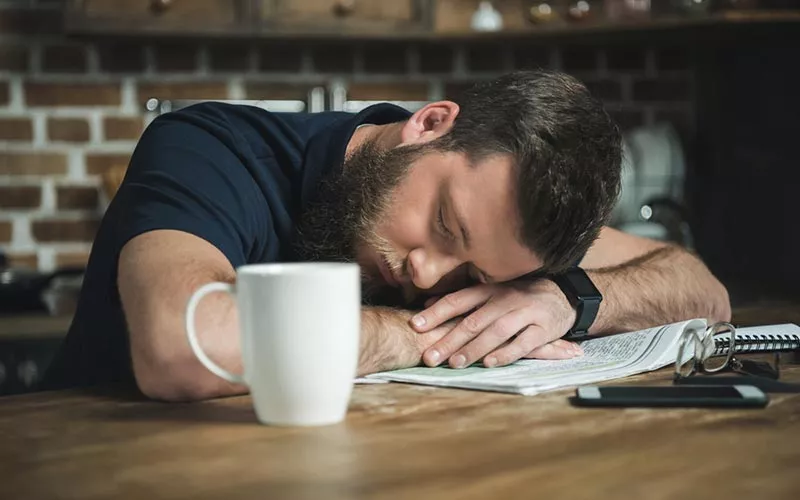 Exhausted guy suffering burnout