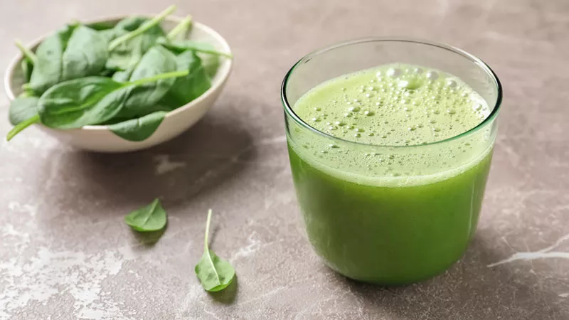 Green smoothie with spinach leaves