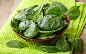 Spinach bowl on green napkin